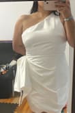 Originally I purchased this dress in a L. Normally I wear L. I read the reviews and I was leaning more towards a L. I tried the dress on but it didn't zipper all the way (zipper is on the left side) being that I am a little big on my bust I had to size up. When receiving the XL it fit a lot better! The only thing I couldn't really convince myself with was the side bow!
I really wanted this to be my dress for my Vegas wedding
Other than the bow, I really loved the material of the dress! No need for stickies, you can go braless.
Didn't work out for me but I'm sure it will look great on someone else :)! - Jacquelin V.