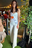 I love this jumpsuit so much! I wore it for my Hen Do and got sooo many compliments. It's lined so not see-through (but also means it's very warm. Might not be suitable for warmer weather!) I went for a size L because I'm a UK 12 on top and 14 on bottom. It fit perfectly on the bottom and was a little big on top, but because of the tie back, I could tie it as tight as I needed. It was perfect. I'm 5ft9 and this was the perfect length when I wore a small heel. So this is very long, perfect for tall gals! Bit of a faff to get on and off though so always had to bring a friend to the bathroom to tie the back up again - Kirsten D.