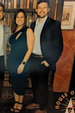 This dress is so flattering and comfy. Great quality material. The shoulder strap goes over the left shoulder. It was a tiny bit small in the bust for me but not uncomfortable, and I was still able to zip it fine. - Sarah V.