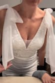 This romper fits like a glove! Even being an XS, it didn't feel snug; there is room for you to move around and even pig around at your party. The tulle should be pressed and makes for a lovely bow. I was very impressed and received many compliments. - Maria L.