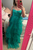The color of this dress is really pretty and I think I would like it if the top fit a little tighter. The dress came really wrinkled, which is normal considering it was shipped, but I still really like the dress. It was a little long on me, and the chest/bust part was too big, but I am also very small chested. - Aubrey G.