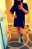 This dress fit true to size. It does run very short. Almost wished I sized up for a little more length. - Jamie C.