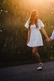 I wore this for engagement photos and loved it so much! It's a little tight in the waist, but it's true to size, in my opinion. It was long enough on me and I'm 5'11. Definitely would recommend this for any bridal events! - Kirsten H.