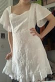 This dress is gorgeous! I ordered the XS, and it fits perfectly. The material is beautiful and I'm already planning on wearing it for multiple occasions, like graduation from university, my upcoming bridal shower, and basically every event I can think of. The only thing I didn't realize about the dress before I bought it is that the neckline comes down pretty low, hitting almost where a corset top would. I really don't mind because it's a beautiful dress, but it's definitely something good to know! - Anne B.