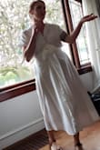 I love the fabric and the fit. It's light and comfortable, not too see through or sheer. It's a classic cut, with a mid century vibe. I received many compliments. It's a great dress for a curvy figure. - Gina M.
