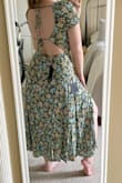 The elastic part on the arm holes is way too tight and uncomfortable. I tried two different sizes and they were the same. The back cutouts are a bit unflattering, seems to highlight any back/side fat. I wish the fabric went straight down from the bottom string part. The length and front of the dress are nice, so I debated keeping it, but the sleeves were just too uncomfortable for me. - Kayla D.