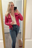 I LOVE this jacket. Absolutely size up. I'm normally a size large but got this in an XL after reading other reviews. I'm so glad I did, it's still a little snug but it's comfortable. - Reana S.