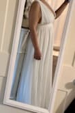 This dress is exactly as pictured I feel. Not cheap feeling material. Ordered for my beach elopement and it's PERFECT. It is a little on the long side but that's fine. - Maribel B.