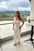 I loved the material; it was perfect for the outside weather. The material was not itchy and stretches. I'm 5'3 so it was a little too long, but I was able to get it altered. Other than that, I love it. I highly recommend it! - Ana M.