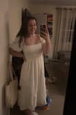 This dress fit perfectly! It is very flattering the way its tighter on the top and flowy on the bottom. The dress falls to about 6 inches past my knee, covering most of my calf. It is a very modest dress! I am using it for my elopement!! - Abigail K.