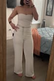 Okay, it's pretty flattering, but it's also pretty tight on the lower half. I'm typically a size 8 (Long -X Long) in jeans. I got it for my graduation, and it's wearable with a couple kinks. It's kind of see-through; granted, it could be user error and might be better if I sized up, but then I think it would be too loose for my girls. Overall a dub but I recommend a thong shapewear for coverage more than anything; if you're comfy enough, go commando. Also, for the tall girlies, it's just long enough for me to wear a kitten heel without any issues. Could wear a bigger heel with slightly high water. Flat-footed, I have less than an inch from the ground. I'm about 57" from hollow to floor for anyone measuring length. - Liz L.