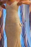 I love this dress so much! It's a little tight but that's how this type of dress should be? I am a thicker, shorter female but this dress was absolutely perfect! THE STRECH this dress is amazing. If you are considering this dress ... DO IT! You won't be disappointed. If you're sized like me, a medium would do as well. I can't wait to wear it on my wedding day in PR in July. - Ashley M.