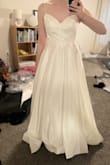 Pretty dress and high quality. Overall, a great value. This same quality dress would cost at least 2-3x the price at a bridal shop. I returned because I didn't think it was very flattering on my body type. I am pretty slender and felt like the dress was swallowing me. This could totally be the perfect dress for a different bride though! - Kaela V.