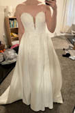This is a thick, heavy, high quality dress. It would easily be $1200+ at a bridal store. I am not keeping because the slit is too low for a church wedding, in my opinion, and it is heavy (we're doing a destination wedding). If the slip wasn't so low, I would've kept this dress - Kaela V.