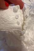 This item came with pen mark or some blue mark on it, buttons were broken and didn't have lace on them like other ones. A little see through but could wear a slip. Pretty dress but had to throw it out, unfortunately :( - Megan W.