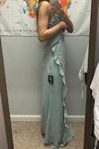 It runs true to size and is super flattering! Definitely a little long but a quick alteration fixes it right up :) - Dakota W.