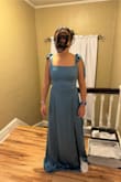 The color was darker in person than in the photo. The shoulder straps don't stay up but we found fun ways to tie the straps in the back. We decided to not go with this dress. - Rachel K.