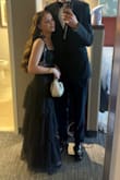 I ordered this dress for a black tie wedding. It was the perfect length and fit and came in fast. I loved the ruffles and the bow-tying straps. The waist part across the middle isn't too see through so it was appropriate but detailed enough that I thought it was a nice touch. I got several compliments, and best of all, I was comfortable all night!!!! - Kiley C.