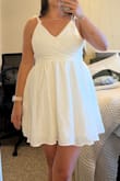 This dress was more poofy than I expected, also the top ties in the back and I could not get it to sit right and have it look like the picture. - Caitlyn R.