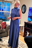 Based on price, fabric, style, color, and fit I give this dress 5 stars.  I was pleasantly surprised by the weight and drape of the fabric, which is just heavy enough to hang nicely and move elegantly. The color is a beautiful royal blue and the style is very flattering. I felt good moving in this dress and could have worn it all night. The high neck and slightly cut in shoulders is flattering, as are the two side slits. It was a little loose on the sides at the bust but could easily be taken in. I'm 5' 8" and it was just slightly long with my kitten heels (I would have preferred ankle length). The photo is taken just out of the box before ironing and it wasn't all that wrinkled. - Joan (.