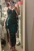 This dress is amazing! It fits true to size and is very flattering. The straps in the back were also very easy to figure out. If you're super short, like me, this dress is a perfect fit. :) - Sarah O.