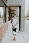 This dress is a must have! Perfect little white dress that can be worn for many occasions. My daughter wore it for her graduation photos and will for the ceremony as well. I love that it's simple with just enough detail to make it stand out. Great quality and isn't see through like some white fabrics. I would recommend nude undergarments though. - AMBER K.