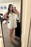 I bought this for graduation, and it fits great. The straps are super adjustable too! It looks super cute, but the material is way shiner than I thought it would be. When I paired it with my cap, gown, and other accessories, I didn't like how it looked put together. Still adorable. If I didn't get it in white, I would have kept it! - Paige H.