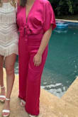 I wish I could've bought the top in L and the pants in XL, I ended up getting it in XL. There is a little stretch in the back but I still felt the L size was slightly too tight. I hold all my weight in my stomach so definitely needed a little extra room there. The length was PERFECT though. I ended up keeping it for a bachelorette party night out and did get a lot of compliments! - Elizabeth E.