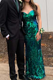 I bought this dress for prom and it worked out okay... I was expecting the dress to reflect green, but it actually also reflects blue so I felt like I was giving a lot of mermaid vibes. ALSO, Be careful with the straps since one of them snapped when I tried the dress on for the first time. I didn't have time to return it since the dance was nearing so I was able to sew the strap back on, but I'm not satisfied with the dress quality and definitely will not be ordering from Lulus again. The dress also kept losing sequins and irritated my arms with how scratchy it felt. - Irene H.