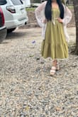 This dress is so beautiful. I love the details in the bow it front. - Sendy O.