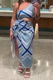 I took this to the Bahamas with me and got soo many complaints! The dress is so beautiful and great quality. The cut out sits at the right spot (I'm 5'1) and the slit is high but sexy for vacay. I'm a DDD and didn't need to wear a bra with this because it was tight enough. The zipper on the side was a little tricky to zip up once on, so you will need help! - Nicole S.