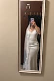 It was a beautiful dress. The only thing that I wasn't the biggest fan of (due to my smaller chest) was the top and the lack of a built in bra/ padding. I am using an adhesive bra and a veil for reference. Everyone I showed the dress is always in awe with it. It is truly gorgeous, and it adjusts in all the right places. I can't wait to wear it in my wedding - Gabriela B.