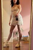 I purchased this outfit for my wedding afterparty. It fits well and it super flattering, however, it is fairly short in the back! It will be really fun to dance in with the tassels. I ordered a Small and Medium, due to the reviews stating it ran small, however, the Small fit perfectly so I returned the Medium. - Rachael R.