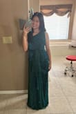 The dress fits perfectly, and the material is very comfortable. The color is a gorgeous, sparkly, almost emerald-like green if you stand in brighter lighting. It also shipped and delivered super quickly. The only minor complaint is that it's slightly difficult to zip up. Overall, I'm very happy with this purchase and I can't wait to wear it to prom. :) - Angelina B.