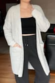 I love this sweater. There was only a size large left, normally I would have gotten a medium in a long sweater like this and especially after reading reviews. I was nervous it would be too large but it is a great fit even at a large. I typically wear a womens large or a 10/12. - Stephanie C.