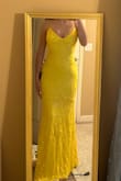 This dress was as beautiful as I'd hoped! It fits perfectly true to size and also has a lace-up back so it can be adjusted! - Raely L.