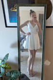 Such a cute dress! The fabric is a good quality and has a lining underneath so it's not see through. Some people might feel like it's too short, but I have long legs and I'm used to dresses being short on me. I love this dress and will be wearing it for my engagement party. - Kelsey B.