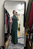 I really love this dress. I bought it for my University student government awards ceremony. The fabric was an odd mix that wrinkled extremely easily so it needed to be steamed just before the event. The fabric also made it impossible to pin the back so as to get it to fit tighter without looking odd in the front, but it still looked stunning. - Maia S.