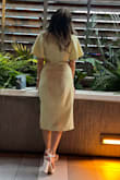 Loved wearing this dress! It's so comfortable and cute. Definitely has a linen feel, and wrinkles like it. I think it's cute that way. - Natalie S.