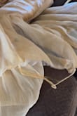 I ordered this dress to wear as Maid of Honor in a wedding. Prior to the wedding, I only put it on to make sure it fit. The week of the wedding, we noticed small frays at the end of each layer. Throughout the day of the wedding, the frays continued to get worse despite being extra careful. It's a beautiful dress and received lots of compliments but it is not worth the price. Unfortunately, I will not be able to get anymore wear from this dress. Attached is a picture of a fray but there is more throughout the dress:( - Maureen T.