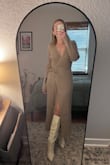 Super cute and it fit perfectly, but it is a wrap dress and I did have to pin it on the bottom so that it wouldn't open all the way while I was walking or sitting. Paired with Lulus tall white boots! - Christine A.