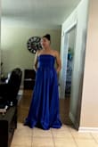 This is a beautiful dress! It fit perfectly. I didn't have to wear a bra but my girls are tiny. I wasn't pulling the dress up nor did I feel like it was sliding down. Caution: If you have it professionally cleaned, it caused my zipper to stick but a little candle wax helped lubricant the teeth. Great buy!! - Tenithe W.