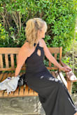 This dress fits perfectly well around your body. It is incredibly flattering in the places it should be. I am a woman in her 40s and feel like I am 20 years old in this dress. I received multiple compliments. I highly recommend this dress for any ball or gala you are attending. - Shelley P.