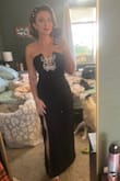 Dress fits well, I've ordered a lot from lulus and a medium has always been perfect. I did use the size quiz they had and it even said medium. I'm a size 4-6 small/ medium and I was pulling the dress up a tad but as expected from a strapless I'd say. I was stopped all night by guests and even staff asking where I got my dress from! Felt great knowing I was wearing an amazing dress. My only disappointment was the butterflies are tacked down only in some places and it holds the top together but it wasn't tacked down evenly and I wish they all were so they didn't move as much. And I did hem the dress. - Cleo I.
