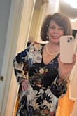 At first I ordered small because I usually wear a size 6. I mailed that back and got the medium. Much better. The fabric is WOW. 
It is a flattering style. The navy is the color I purchased. The wedding will be in NYC and it will be windy and chilly so I am wearing a black clingy v neck shirt and back leggings underneath. I hate being cold. - Paula M.