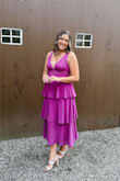 This dress is so flattering! Depending on the material, I have bought dresses from Lulus in M up to XL. I bought a L in this dress and it fits perfectly! I'm a little broad and had a little difficulty zipping up the dress on the side, but once fully zipped I was very comfortable! The straps aren't adjustable but that wasn't a problem for me. Obsessed with this dress and will now find any excuse to wear it! - Victoria A.