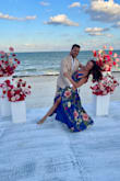 I purchased this dress to wear to a destination wedding in Mexico and this dress was perfect! The colors are even more vibrant than shown in the photos and the cut is beautiful and flattering. I have a fairly small chest so I didn't have to worry about wearing a bra. I could see how this dress would be tricky if you had a larger chest though because I don't think anything besides sticky boobs or tape would work with the cut.
It's absolutely stunning though. I got lots of compliments and was very comfortable. - Savannah H.