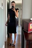 This dress fits so good. Very high quality fabric. Love the back cut out detail. Ruffle sleeves give it the perfect feminine touch. - Amanda D.