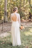 I bought this dress for my wedding this past October. The back was gorgeous, and the skirt flowed beautifully. Everything was comfortable and stayed in place. It was very easy to move around in. Couldn't have been happier with this dress! - Heather T.