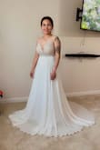 The top part of the dress is heavy, but it's gorgeous! One of the pads was not stitched well, but it was usable. The strap is a little long, and the waist part is tight. I need to lose a few inches, lol - Jo-anne M.